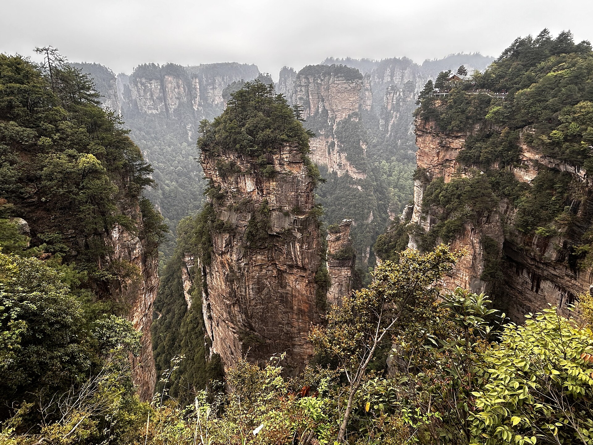 Quartz sandstone pillars rising through mist in Wulingyuan
